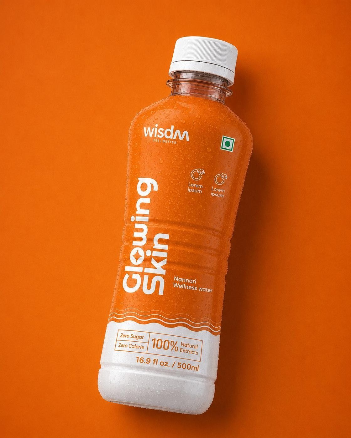 wisdm Glowing Skin bottle on an orange backdrop